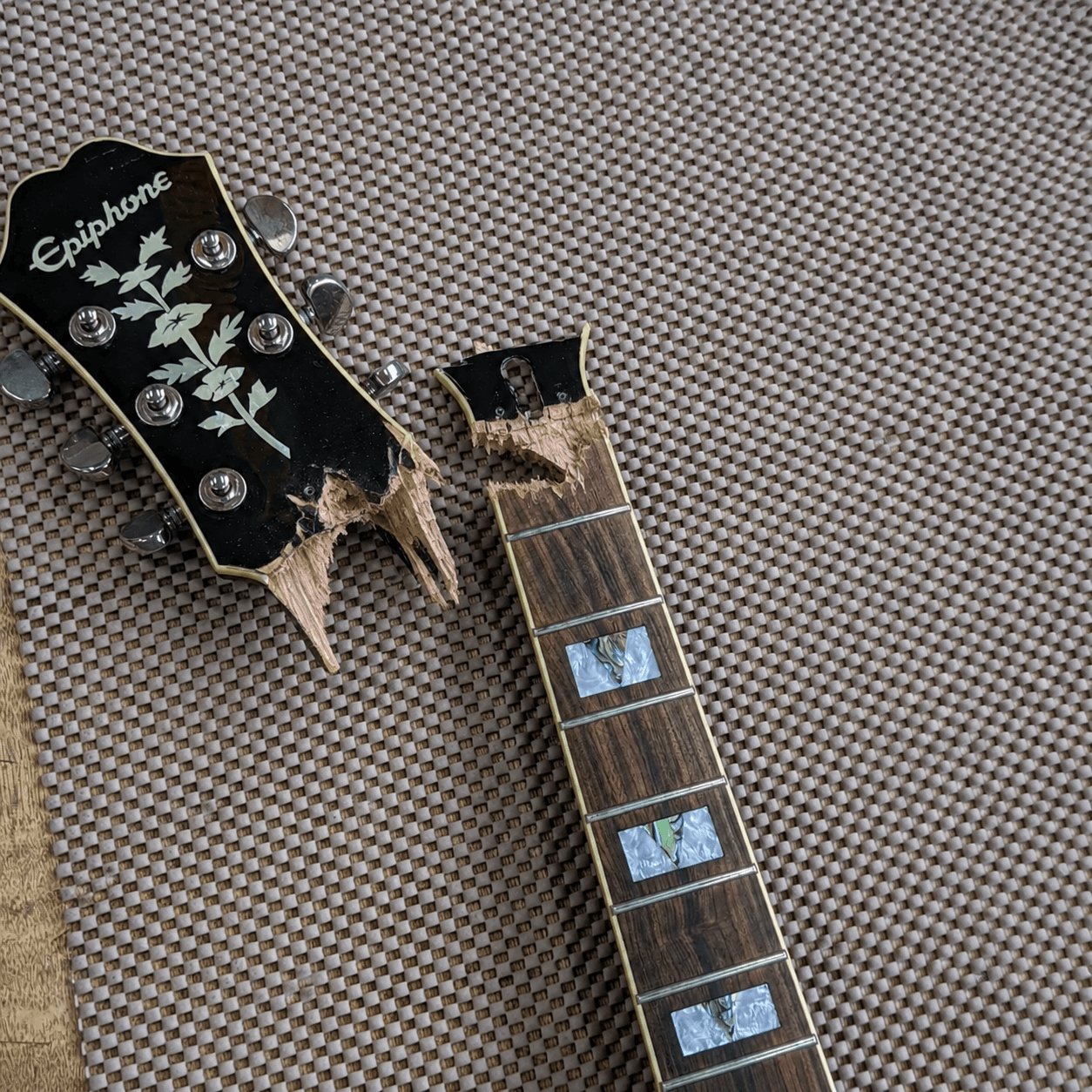 Broken guitar neck prepared for instrument repair