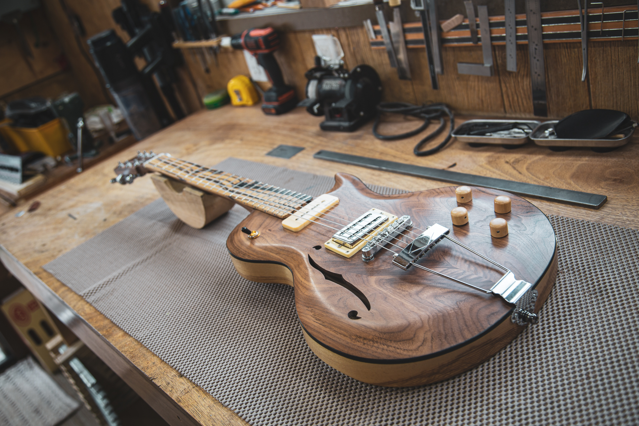 Custom guitar on the Strasdin Instruments workshop bench